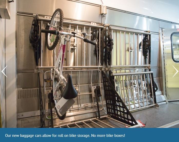 A bike hangs on a rack in an amtrak luggage car