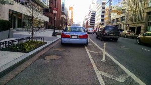 In the protected bike lane?! | Photo credit: Ursula Sandstrom